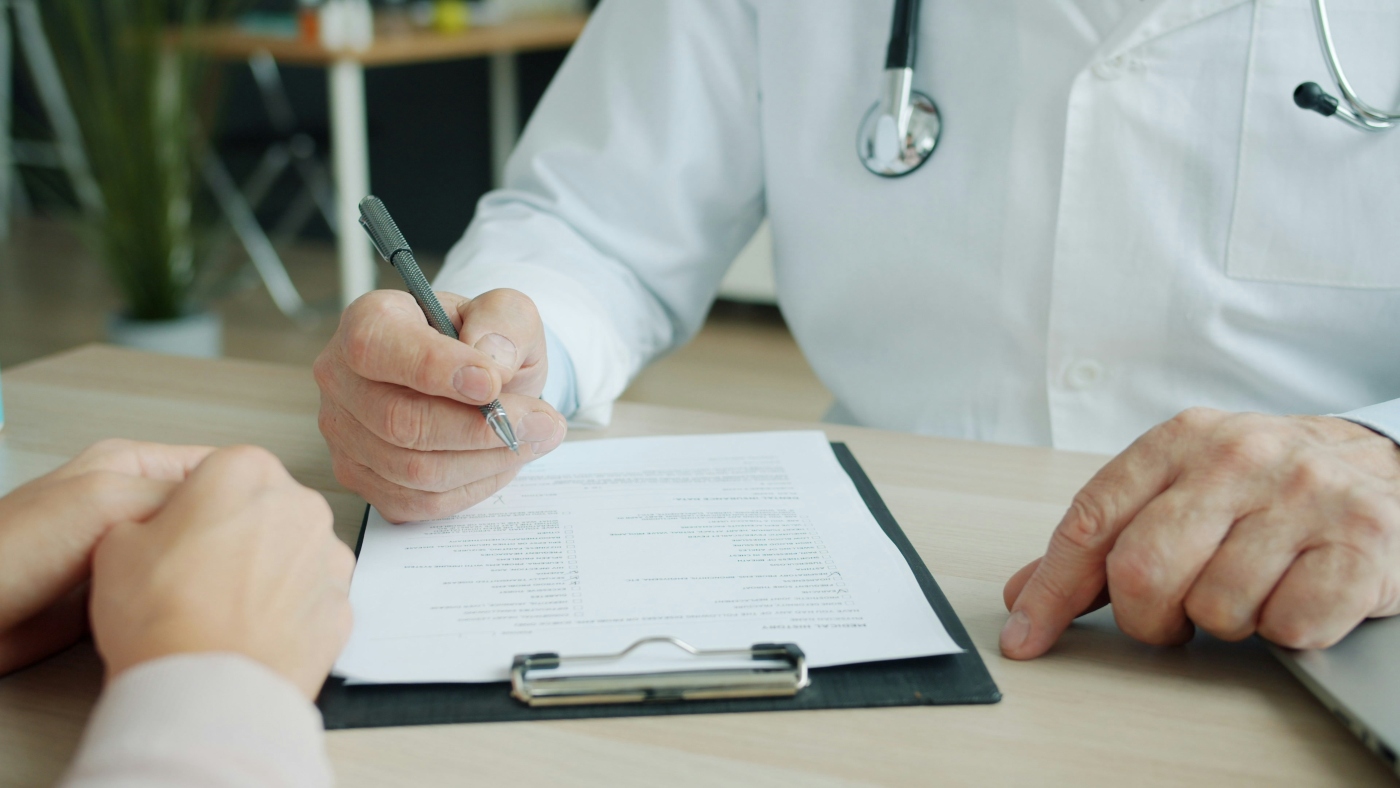 Doctor discussing case details with patient